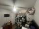 Spacious bedroom with a TV and plenty of closet space at 1606 Lime St, Kissimmee, FL 34746