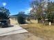 Charming single story home with solar panels and driveway at 1606 Lime St, Kissimmee, FL 34746