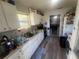 Kitchen with white cabinets and appliances at 1606 Lime St, Kissimmee, FL 34746