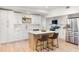 Modern kitchen with white cabinets, quartz countertops and island at 1640 Chinook Trl, Maitland, FL 32751