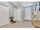 Bright entryway with tile flooring and neutral color scheme at 1707 Point O Woods Ct, Mount Dora, FL 32757