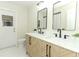 Updated bathroom with double vanity, marble countertop, and black accents at 1710 Aster Dr, Winter Park, FL 32792