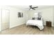 Cozy bedroom with hardwood floors and mirrored closet doors at 1710 Aster Dr, Winter Park, FL 32792