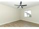 Bright bedroom with laminate wood floor, ceiling fan, and window at 1710 Aster Dr, Winter Park, FL 32792