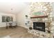 Stone fireplace in the living room with a modern mantel at 1710 Aster Dr, Winter Park, FL 32792