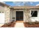 Inviting front entry with stone pillars and a double door at 1710 Aster Dr, Winter Park, FL 32792