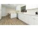 Newly renovated kitchen with white cabinets, quartz countertops and stainless steel appliances at 1710 Aster Dr, Winter Park, FL 32792
