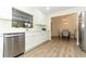 Updated kitchen with stainless steel appliances and white cabinetry at 1710 Aster Dr, Winter Park, FL 32792