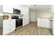 Updated kitchen featuring white cabinets, quartz countertops, and stainless steel appliances at 1710 Aster Dr, Winter Park, FL 32792
