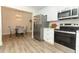 Modern kitchen with stainless steel appliances and white shaker cabinets at 1710 Aster Dr, Winter Park, FL 32792