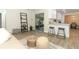 Spacious living area with hardwood floors, modern shelving and access to the kitchen at 1710 Aster Dr, Winter Park, FL 32792