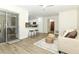 Open concept living room with a view of the kitchen and access to the patio at 1710 Aster Dr, Winter Park, FL 32792