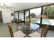 Relaxing screened patio with pool view and outdoor dining set at 1710 Aster Dr, Winter Park, FL 32792