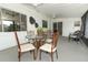 Screened patio with outdoor dining set and wicker chairs at 1710 Aster Dr, Winter Park, FL 32792