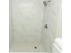 Clean and bright shower with marble tile and hexagon floor tiles at 1710 Aster Dr, Winter Park, FL 32792