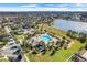 Community pool, playground, and lakefront view from above at 1826 Plantation Oak Dr, Orlando, FL 32824