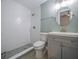 Updated bathroom with subway tile shower and gray vanity at 2419 Rio Pinar Lakes Blvd, Orlando, FL 32822