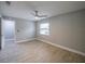 Well-lit bedroom with ceiling fan and wood-look tile flooring at 2419 Rio Pinar Lakes Blvd, Orlando, FL 32822
