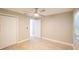 Charming bedroom with ceiling fan, wood-look floors and double-door closet at 2419 Rio Pinar Lakes Blvd, Orlando, FL 32822