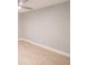 Spacious bedroom featuring light gray walls and wood-look tile floors at 2419 Rio Pinar Lakes Blvd, Orlando, FL 32822