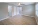 Spacious bedroom with ceiling fan and wood-look tile flooring at 2419 Rio Pinar Lakes Blvd, Orlando, FL 32822