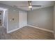Spacious bedroom with ceiling fan and wood-look tile flooring at 2419 Rio Pinar Lakes Blvd, Orlando, FL 32822