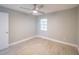 Well-lit bedroom with ceiling fan, wood-look floors, and window with blinds at 2419 Rio Pinar Lakes Blvd, Orlando, FL 32822