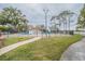 Community swimming pool with surrounding grassy area at 2419 Rio Pinar Lakes Blvd, Orlando, FL 32822