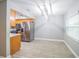 Dining area with wood-look tile floor and modern light fixture at 2419 Rio Pinar Lakes Blvd, Orlando, FL 32822