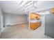 Modern kitchen with stainless steel appliances and wood cabinets at 2419 Rio Pinar Lakes Blvd, Orlando, FL 32822