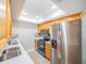 Updated kitchen with stainless steel appliances and wood cabinets at 2419 Rio Pinar Lakes Blvd, Orlando, FL 32822