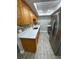 Modern kitchen featuring stainless steel refrigerator and wood cabinets at 2419 Rio Pinar Lakes Blvd, Orlando, FL 32822