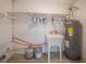 Functional laundry room with utility sink and water heater at 2419 Rio Pinar Lakes Blvd, Orlando, FL 32822