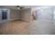 Open concept living room and kitchen with wood-look tile flooring at 2419 Rio Pinar Lakes Blvd, Orlando, FL 32822