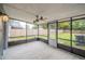 Spacious screened porch overlooking backyard with ceiling fan at 2419 Rio Pinar Lakes Blvd, Orlando, FL 32822