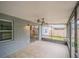 Bright screened porch with view of backyard and ceiling fan at 2419 Rio Pinar Lakes Blvd, Orlando, FL 32822