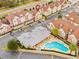 Aerial view of community pool and surrounding townhomes at 2634 Sunrise Shores Dr, Kissimmee, FL 34747