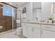 Bathroom with walk-in shower, granite vanity, and modern fixtures at 2634 Sunrise Shores Dr, Kissimmee, FL 34747