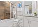 Clean bathroom with tub, shower, and granite vanity at 2634 Sunrise Shores Dr, Kissimmee, FL 34747