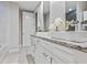 Elegant bathroom with double vanity and granite countertops at 2634 Sunrise Shores Dr, Kissimmee, FL 34747