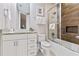 Bathroom with tub, shower, granite vanity, and modern fixtures at 2634 Sunrise Shores Dr, Kissimmee, FL 34747
