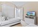 Two twin beds and a dresser with TV at 2634 Sunrise Shores Dr, Kissimmee, FL 34747