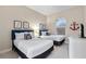Bedroom with two twin beds, nightstands, and nautical-themed decor at 2634 Sunrise Shores Dr, Kissimmee, FL 34747