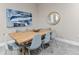 Elegant dining room featuring a large wooden table and gray chairs at 2634 Sunrise Shores Dr, Kissimmee, FL 34747