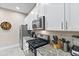 Modern kitchen with white cabinets and granite countertops at 2634 Sunrise Shores Dr, Kissimmee, FL 34747