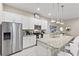 Modern kitchen with stainless steel appliances and an island at 2634 Sunrise Shores Dr, Kissimmee, FL 34747