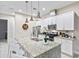 Modern kitchen with granite island and stainless steel appliances at 2634 Sunrise Shores Dr, Kissimmee, FL 34747