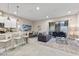 Open living area with gray sofa and access to backyard at 2634 Sunrise Shores Dr, Kissimmee, FL 34747