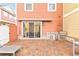 Brick patio with outdoor kitchen and lounge chairs at 2634 Sunrise Shores Dr, Kissimmee, FL 34747
