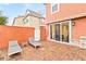Relaxing brick patio with lounge chairs and access to the home at 2634 Sunrise Shores Dr, Kissimmee, FL 34747